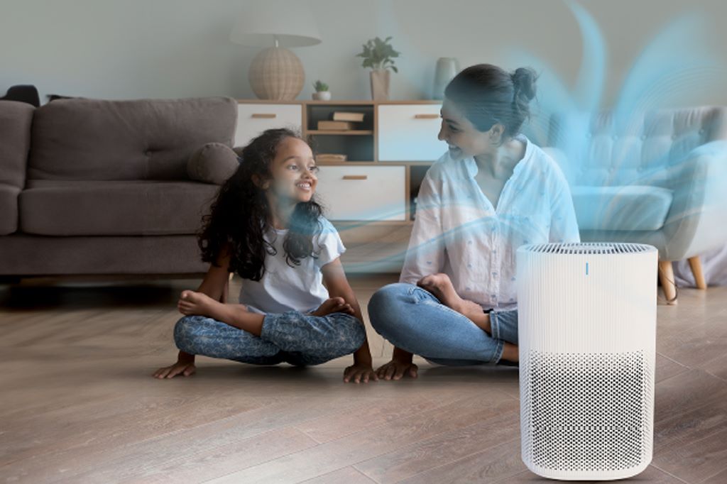 Quiet air purifier running in a large living room for clean air circulation
